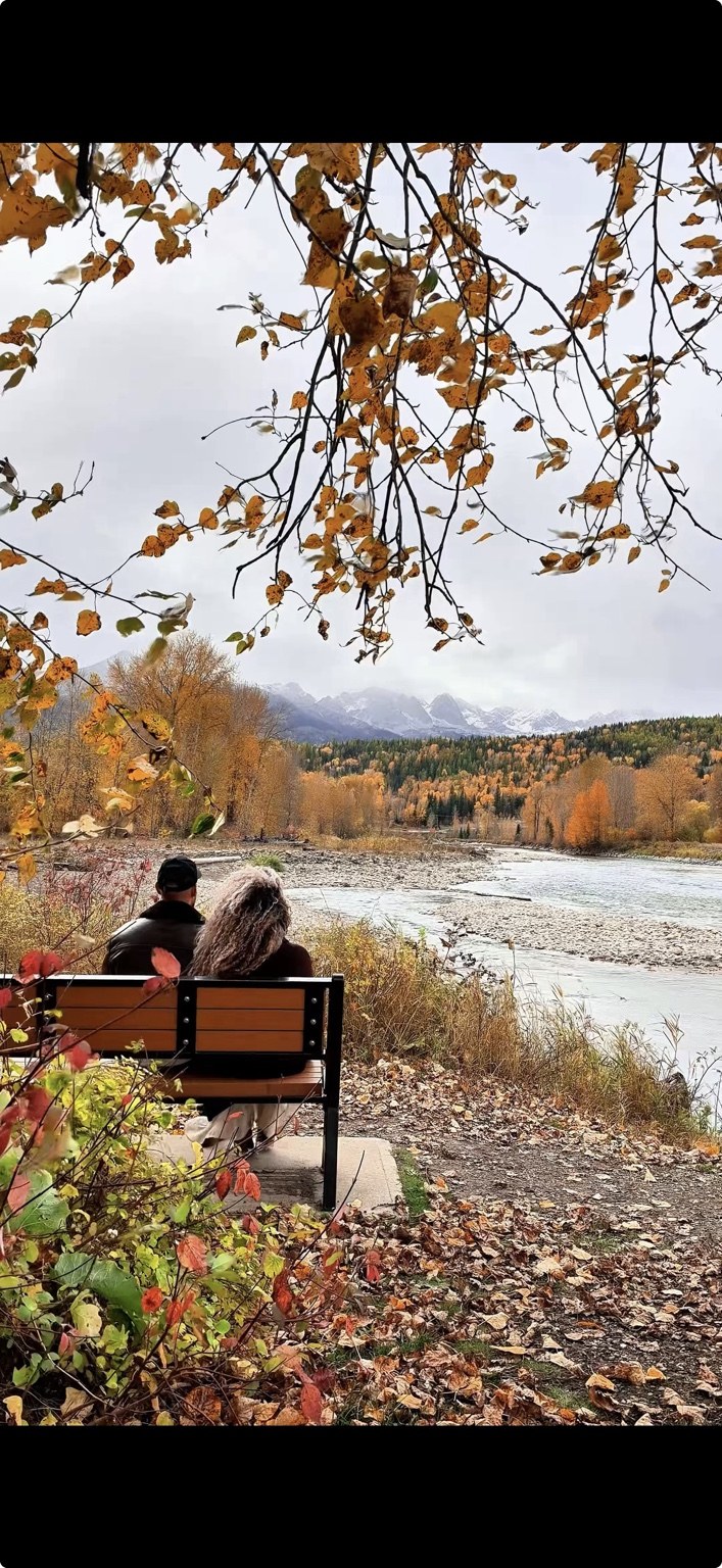 Shabina and Adi overlooking the river and fall colours in Fernie